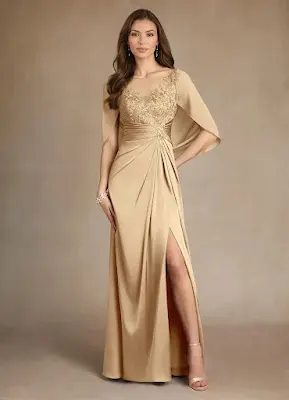 Gold Cape-Sleeve Split Evening Gown Model wearing a long, shimmering gold evening gown with a high leg split, featuring a fitted bodice with gold embroidery and attached sheer cape sleeves.
